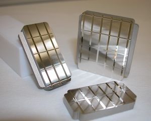 Injection mould with an array of cylinder-lens devices. Additional tooling.